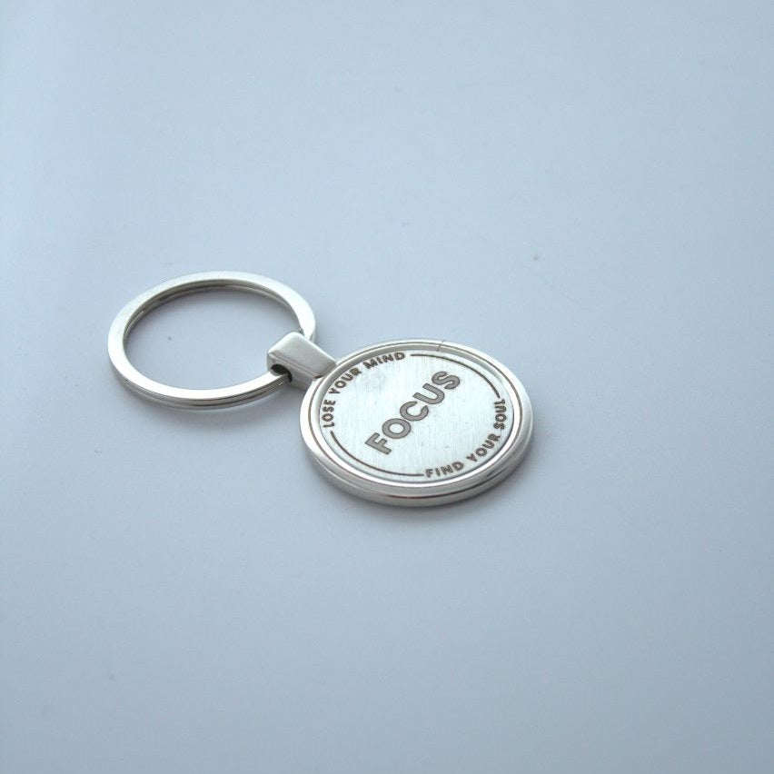 This premium-quality round keychain is an ideal gift idea that you can personalize with up to 3 text messages and an icon of your choice printed in steel metallic. I